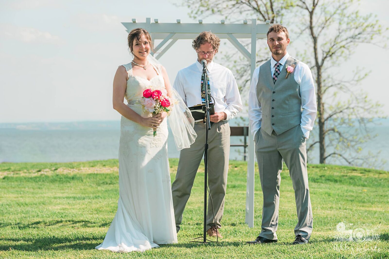 exchanging vows at Harbor View Event Center